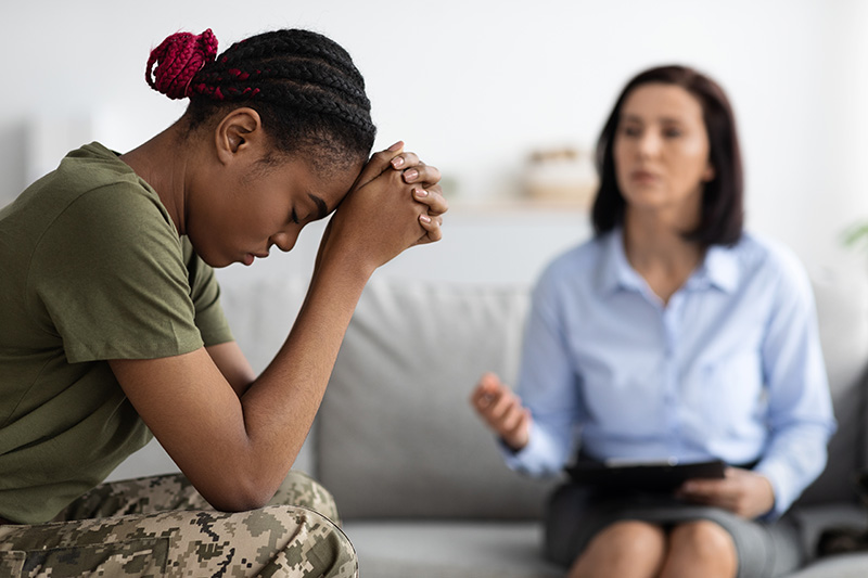 A veteran participates in a therapy session during treatment for PTSD and alcohol abuse.