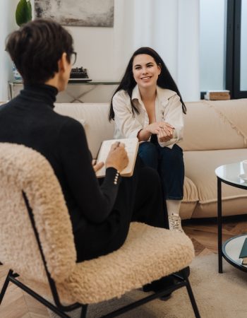 A woman participates in therapy at a drug rehab.